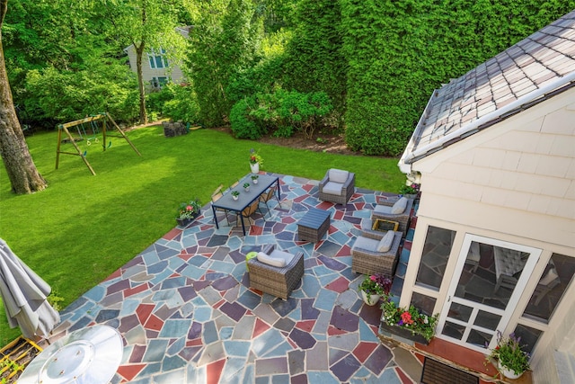 view of patio featuring a playground and an outdoor hangout area