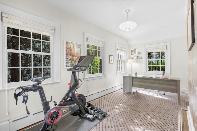 workout room with baseboards, a baseboard heating unit, and healthy amount of natural light