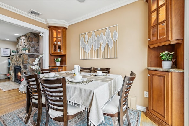 502S11th St., New Hyde Park, NY 11040 - dining space with light wood finished floors, ornamental molding, and baseboard heating