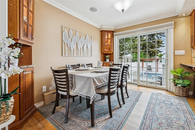 502S11th St., New Hyde Park, NY 11040 - dining area with ornamental molding and light wood-style floors