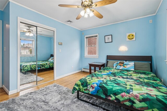 502S11th St., New Hyde Park, NY 11040 - bedroom featuring wood finished floors, ornamental molding, baseboards, a closet, and a ceiling fan