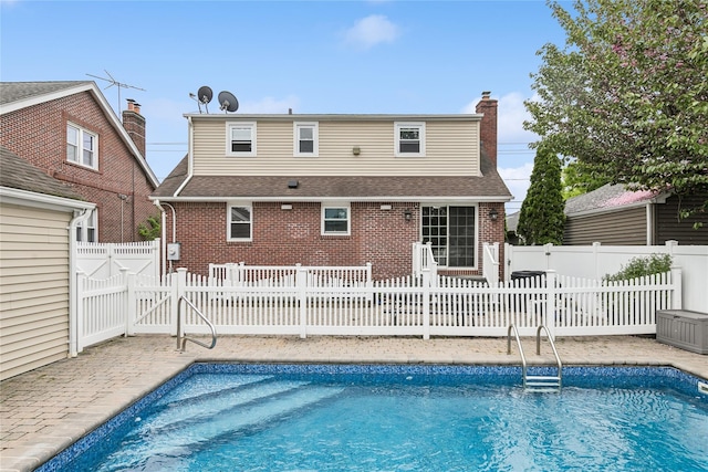 502S11th St., New Hyde Park, NY 11040 - back of house with brick siding, a patio, a chimney, and a shingled roof