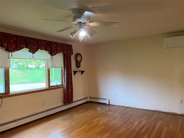 18 Prides Xing, Washingtonville, NY 10992 - empty room with a wall unit AC, a baseboard radiator, wood finished floors, and ceiling fan