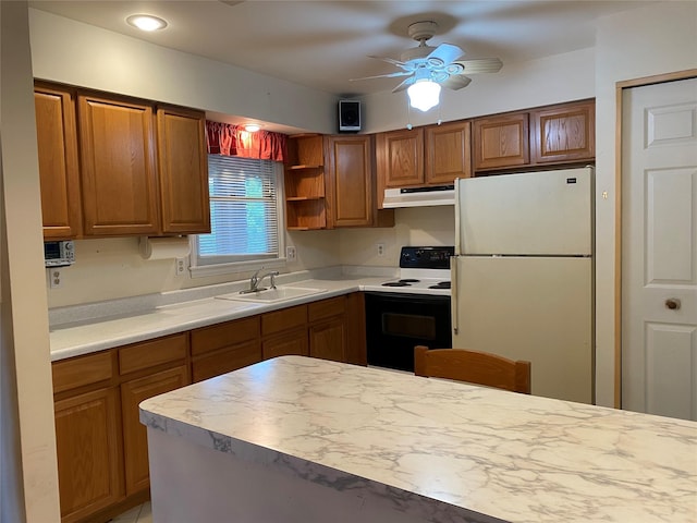 18 Prides Xing, Washingtonville, NY 10992 - kitchen with freestanding refrigerator, electric range, a sink, under cabinet range hood, and brown cabinetry