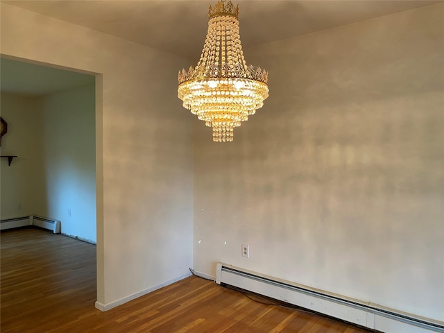 18 Prides Xing, Washingtonville, NY 10992 - unfurnished dining area featuring a baseboard heating unit, wood finished floors, a chandelier, and baseboards