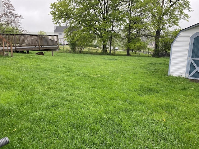 18 Prides Xing, Washingtonville, NY 10992 - view of yard featuring a wooden deck, an outdoor structure, and a storage unit