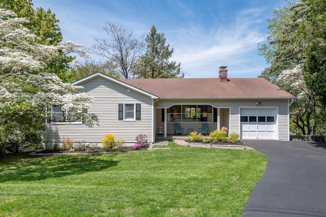 25 Ganung Dr, Ossining, NY 10562 - ranch-style home featuring an attached garage, a chimney, driveway, a front lawn, and covered porch