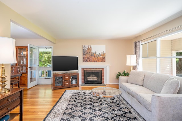 25 Ganung Dr, Ossining, NY 10562 - living room featuring light wood-type flooring and a brick fireplace