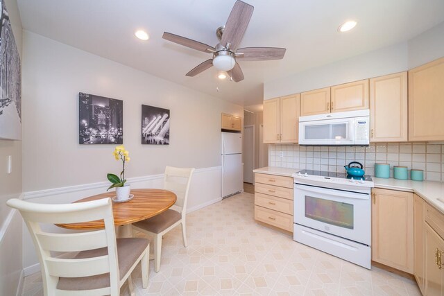 25 Ganung Dr, Ossining, NY 10562 - kitchen with white appliances, light brown cabinetry, light countertops, tasteful backsplash, and a ceiling fan