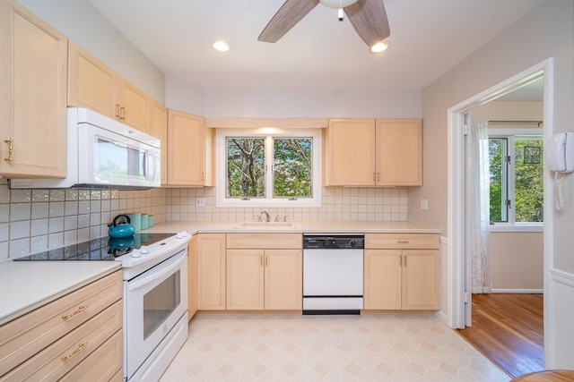 25 Ganung Dr, Ossining, NY 10562 - kitchen with white appliances, light brown cabinetry, a sink, light countertops, and tasteful backsplash