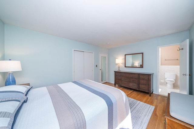25 Ganung Dr, Ossining, NY 10562 - bedroom featuring light wood finished floors, ensuite bath, and a closet