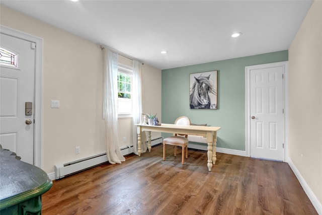 home office featuring wood finished floors, baseboards, recessed lighting, and baseboard heating