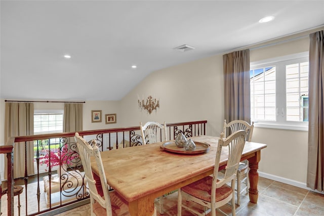 dining room with lofted ceiling, baseboards, and recessed lighting