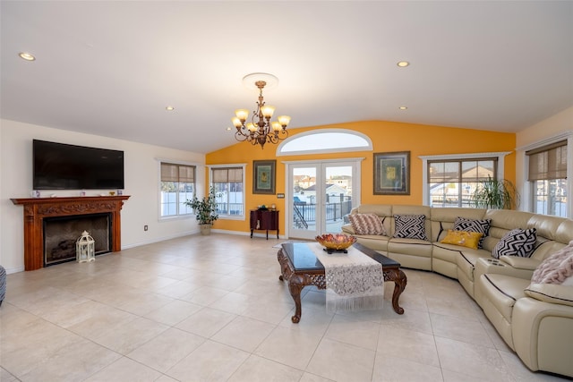 living room featuring lofted ceiling, a chandelier, plenty of natural light, a fireplace, and light tile patterned floors