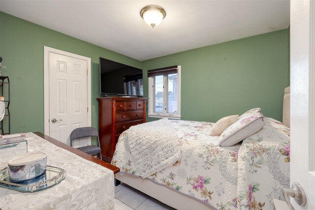 bedroom with tile patterned floors