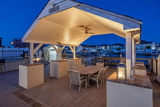 patio at twilight with outdoor dining area