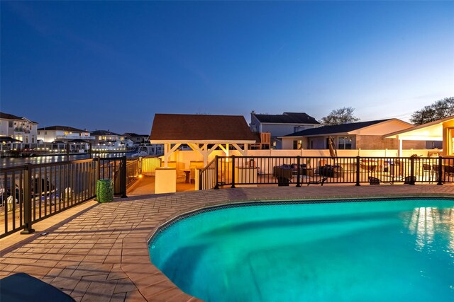 view of swimming pool featuring a residential view