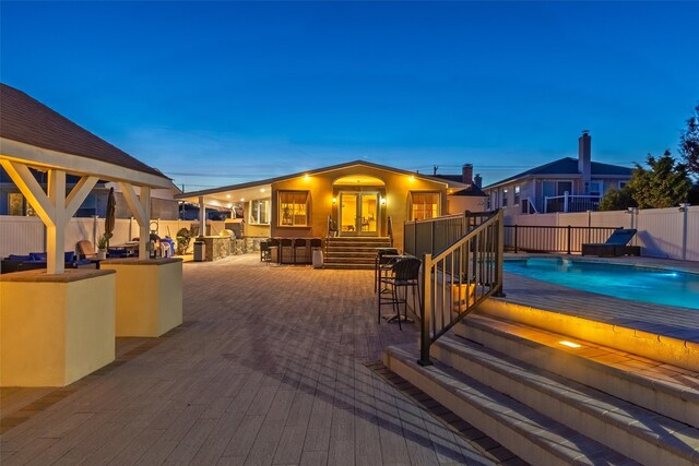 deck featuring fence and a patio