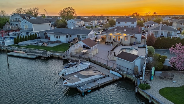 aerial view at dusk of a residential view and a water view