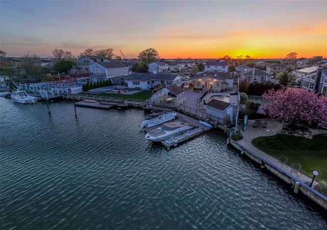 aerial view at dusk of a residential view and a water view