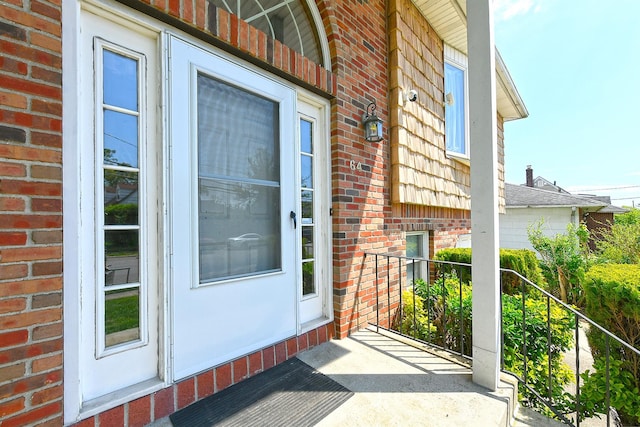 64 S Nassau St, Bethpage, NY 11714 - doorway to property with brick siding