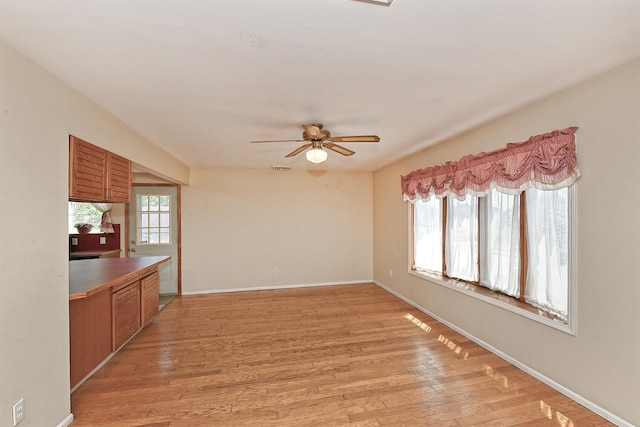 64 S Nassau St, Bethpage, NY 11714 - unfurnished room featuring ceiling fan, light wood finished floors, and baseboards