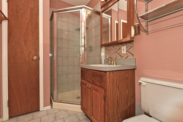 64 S Nassau St, Bethpage, NY 11714 - bathroom featuring a stall shower, toilet, tile patterned flooring, vanity, and decorative backsplash