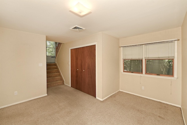 64 S Nassau St, Bethpage, NY 11714 - unfurnished bedroom featuring a closet, carpet floors, and baseboards