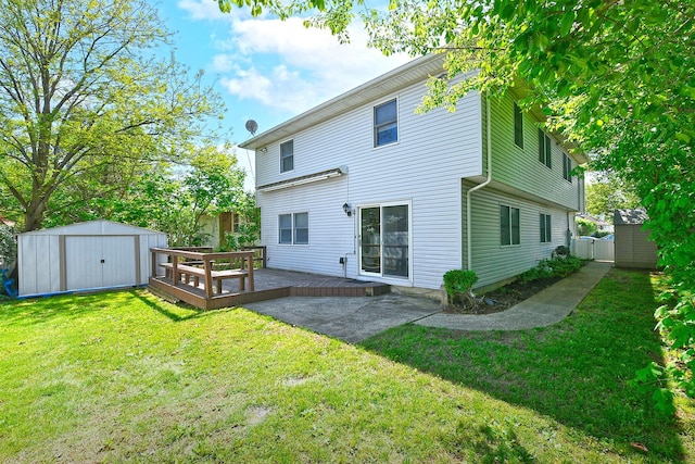 64 S Nassau St, Bethpage, NY 11714 - rear view of house with a shed, an outbuilding, a wooden deck, and a yard