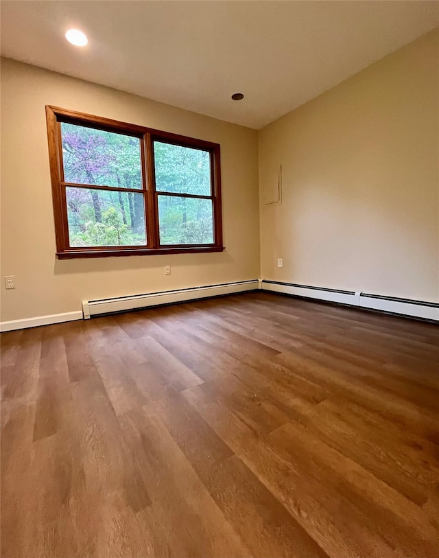 51 Pine Ct, Middletown, NY 10941 - empty room featuring wood finished floors, baseboards, recessed lighting, and a baseboard heating unit