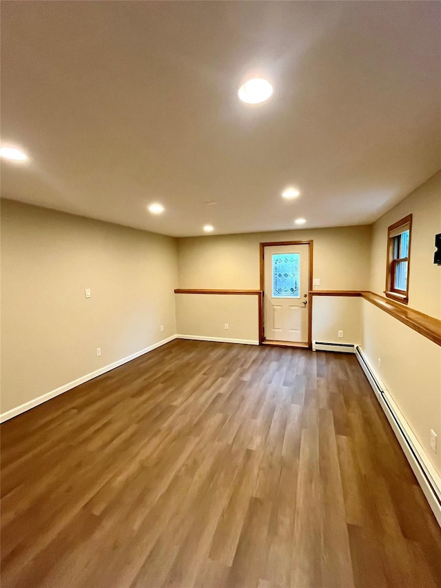 51 Pine Ct, Middletown, NY 10941 - basement featuring a baseboard radiator, wood finished floors, recessed lighting, and baseboards