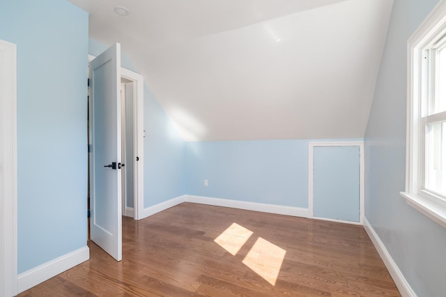 13 Curve Ln, Levittown, NY 11756 - bonus room featuring lofted ceiling, wood finished floors, and baseboards
