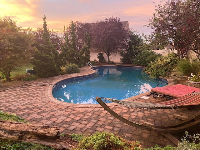 139 Coronado St, Atlantic Beach, NY 11509 - pool at dusk featuring a patio and a fenced backyard
