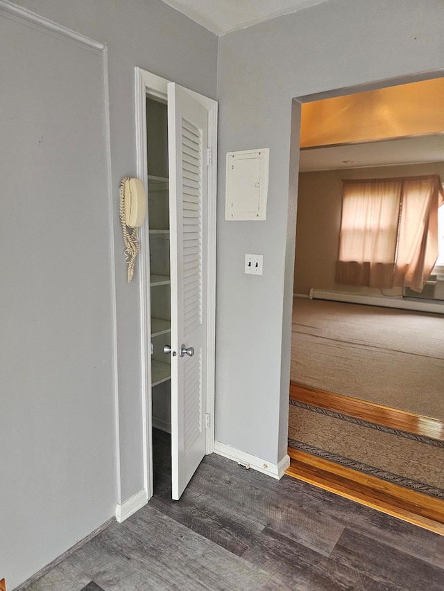 interior space featuring wood finished floors and baseboards