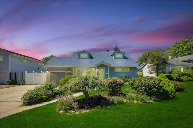 cape cod house with concrete driveway, a garage, and roof with shingles