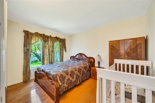 bedroom with light wood finished floors