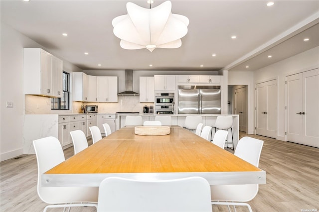 1350 Hortons Ln, Southold, NY 11971 - dining room with light wood-style floors, recessed lighting, and baseboards