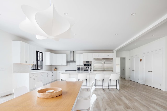 1350 Hortons Ln, Southold, NY 11971 - dining space with light wood-style flooring and recessed lighting