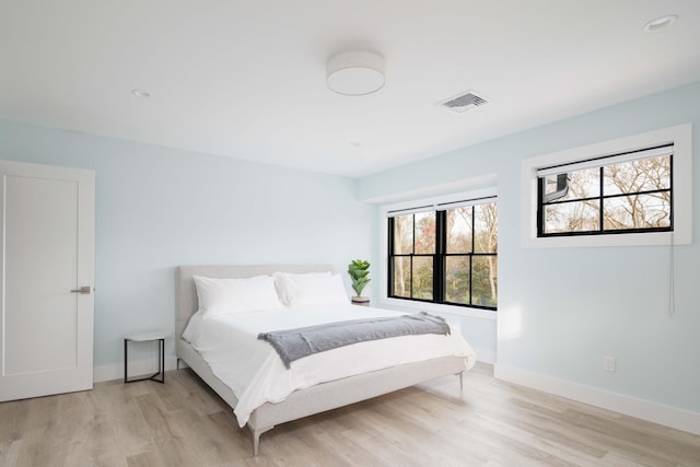 1350 Hortons Ln, Southold, NY 11971 - bedroom with light wood-type flooring, baseboards, and recessed lighting