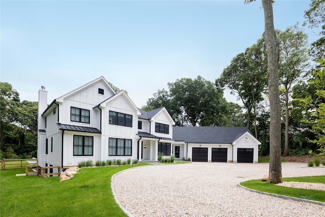 1350 Hortons Ln, Southold, NY 11971 - modern farmhouse style home with driveway, board and batten siding, a garage, a standing seam roof, and a chimney