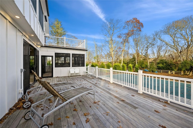 1350 Hortons Ln, Southold, NY 11971 - wooden deck with a sunroom and a pool