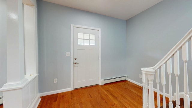 74 Gladstone Ave, Walden, NY 12586 - entryway featuring baseboard heating, light wood-style floors, baseboards, and stairs