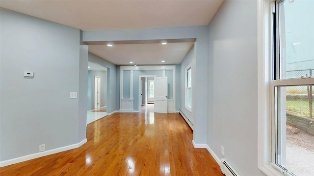 74 Gladstone Ave, Walden, NY 12586 - corridor with a baseboard heating unit, wood finished floors, baseboards, and recessed lighting