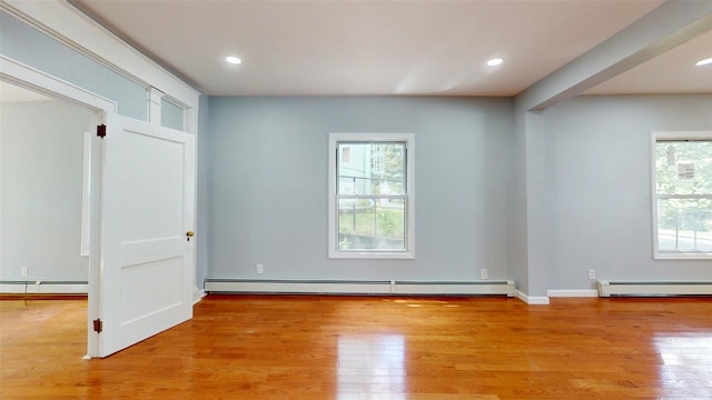 74 Gladstone Ave, Walden, NY 12586 - unfurnished room featuring a baseboard heating unit, a baseboard radiator, light wood-style flooring, and recessed lighting