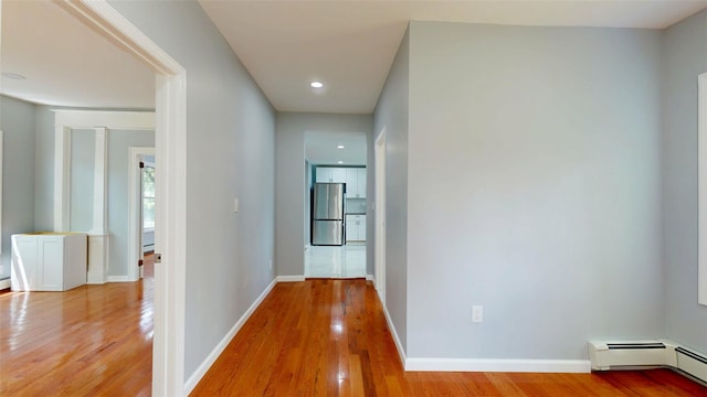 74 Gladstone Ave, Walden, NY 12586 - hall with a baseboard heating unit, light wood-style floors, baseboards, and recessed lighting