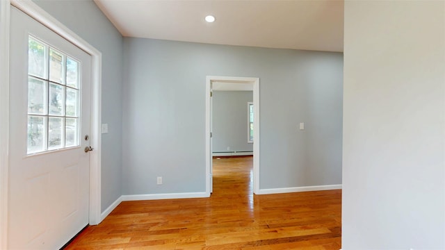 74 Gladstone Ave, Walden, NY 12586 - doorway with light wood-style flooring, baseboard heating, recessed lighting, and baseboards