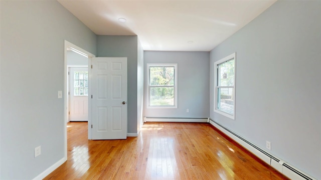 74 Gladstone Ave, Walden, NY 12586 - unfurnished bedroom with a baseboard heating unit, light wood-type flooring, and baseboards