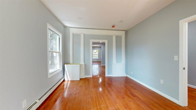 74 Gladstone Ave, Walden, NY 12586 - unfurnished room featuring baseboard heating, healthy amount of natural light, light wood-type flooring, and baseboards