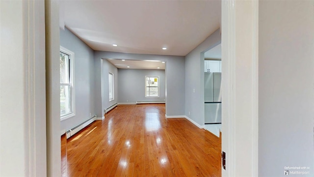 74 Gladstone Ave, Walden, NY 12586 - hall with a baseboard heating unit, light wood-style floors, baseboards, and recessed lighting
