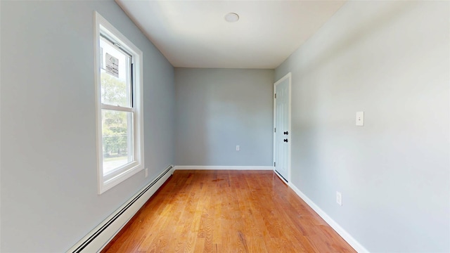 74 Gladstone Ave, Walden, NY 12586 - unfurnished room featuring baseboard heating, plenty of natural light, light wood-type flooring, and baseboards